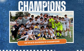 A soccer team celebrates their victory, holding a trophy and sign